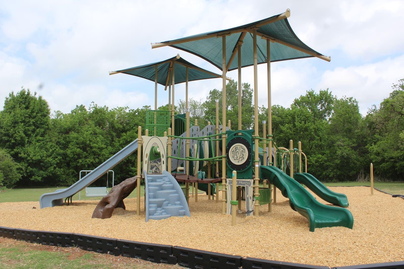 Treehouse Playground — slides and tunnel