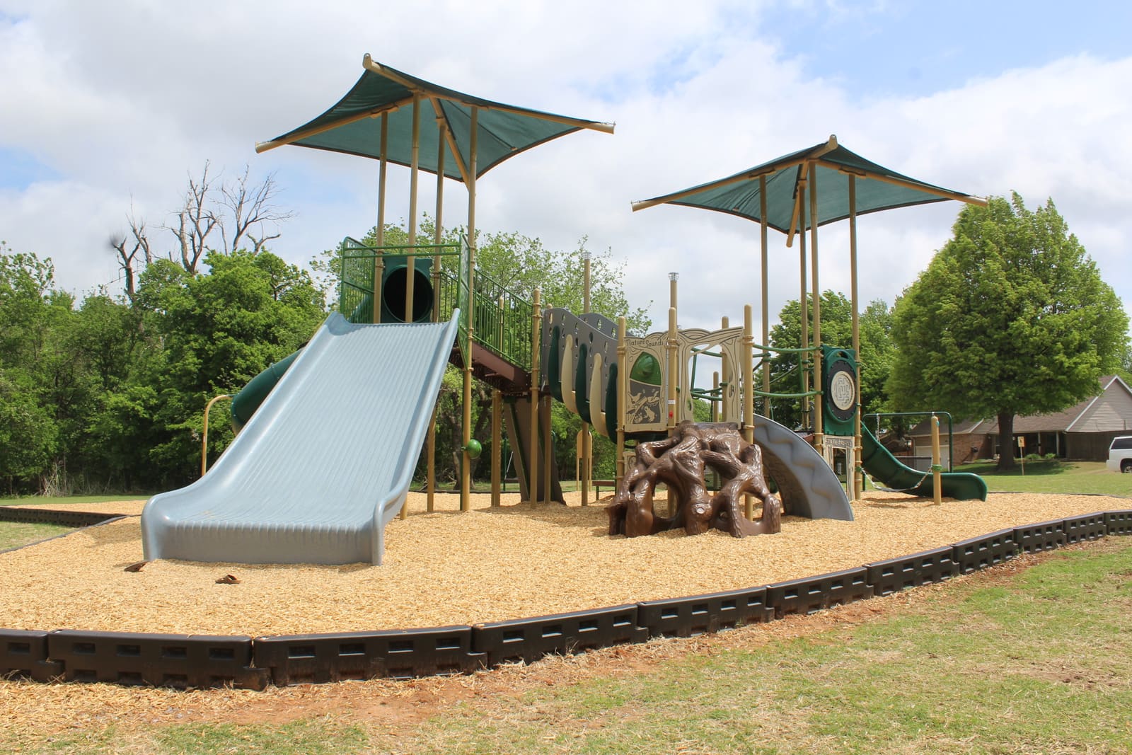 Treehouse Playground — overall view with shade covers